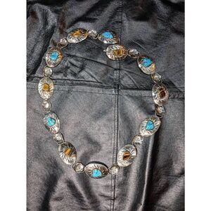 Concho Turquoise and Tiger eye stone belt. In a silver setting.